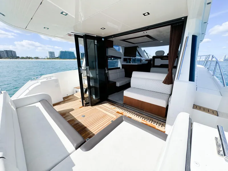 Slide: The Image of Luxurious 2016 Galeon 420 Fly yacht interior with spacious seating and ocean view. - 13