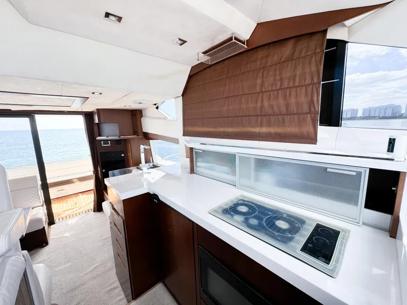 Slide: The Image of Luxurious interior of 2016 Galeon 420 Fly yacht with modern kitchen and sea view. - 19