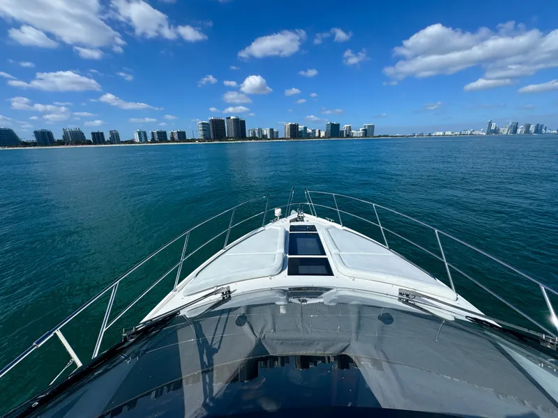 Slide: The Image of Galeon 420 Fly 2016 yacht cruising on blue ocean with city skyline. - 27