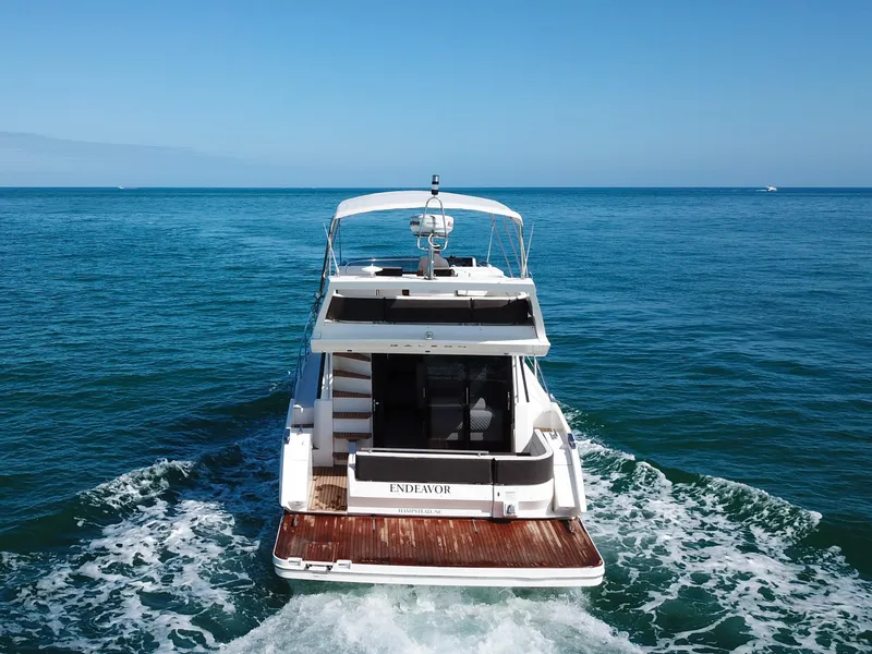 Slide: The Image of 2016 Galeon 420 Fly yacht cruising on open sea, rear view. - 3