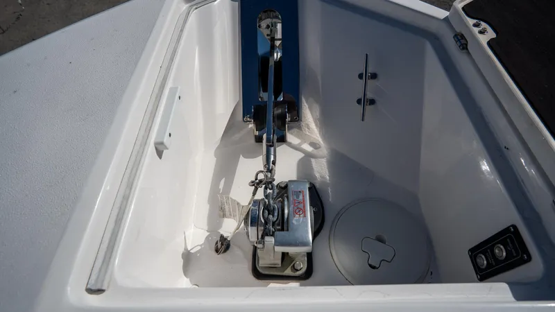 Slide: The Image of 2024 Sea Fox 268 Commander anchor compartment with chain and winch. - 11