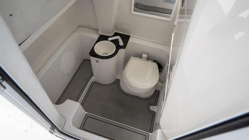 Slide: The Image of 2024 Sea Fox 268 Commander boat bathroom interior with toilet and sink. - 19