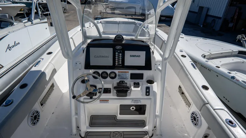 Slide: The Image of 2024 Sea Fox 268 Commander boat dashboard with Garmin and Simrad displays. - 25