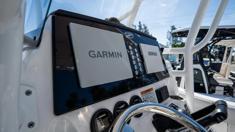 Slide: The Image of 2024 Sea Fox 268 Commander dashboard with Garmin and Simrad displays. - 27