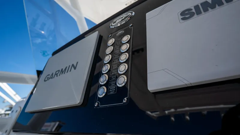 Slide: The Image of Close-up of 2024 Sea Fox 268 Commander dashboard with Garmin and Simrad displays. - 29