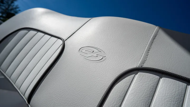 Slide: The Image of 2024 Sea Fox 268 Commander boat seat with embossed logo, white leather upholstery. - 32