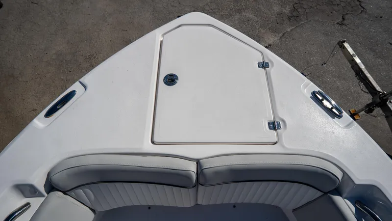 Slide: The Image of 2024 Sea Fox 268 Commander boat bow with seating and storage compartment. - 9
