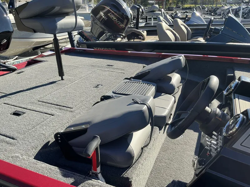 Slide: The Image of 2025 Lowe Stinger ST175 boat interior with seating and steering wheel. - 5