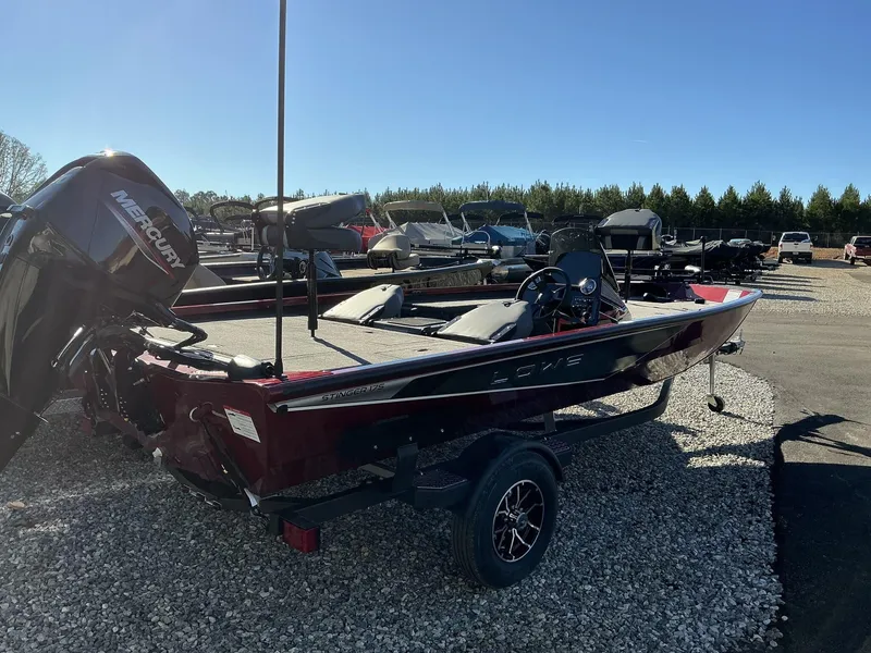 Slide: The Image of 2025 Lowe Stinger ST175 boat with Mercury engine on gravel lot. - 7