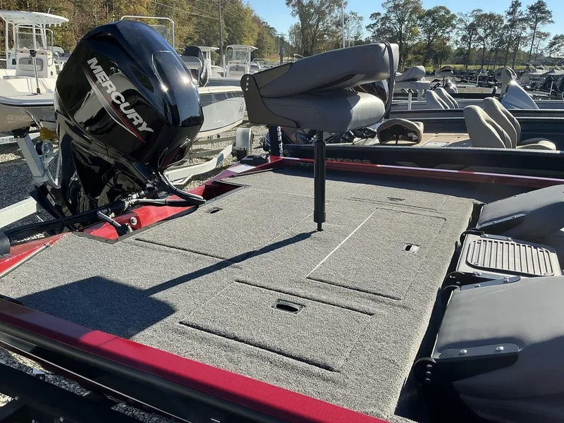 Slide: The Image of 2025 Lowe Stinger ST175 boat with Mercury engine, featuring spacious deck and seating. - 8