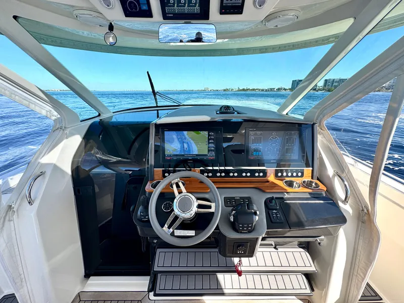 Slide: The Image of 2018 Tiara Yachts 38 LS helm with advanced navigation system on open water. - 1