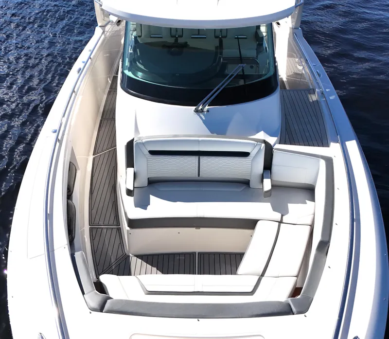 Slide: The Image of 2018 Tiara Yachts 38 LS boat with spacious seating on water. - 13