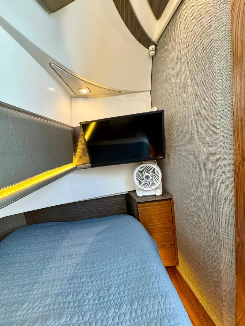 Slide: The Image of Interior cabin of 2018 Tiara Yachts 38 LS with TV and fan. - 14