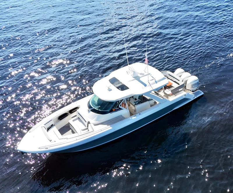 Slide: The Image of 2018 Tiara Yachts 38 LS cruising on sparkling blue water. - 24