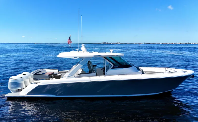 Slide: The Image of 2018 Tiara Yachts 38 LS on open water under clear blue sky. - 28