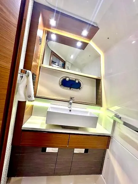 Slide: The Image of Luxurious bathroom interior of 2018 Tiara Yachts 38 LS with modern sink and lighting. - 35