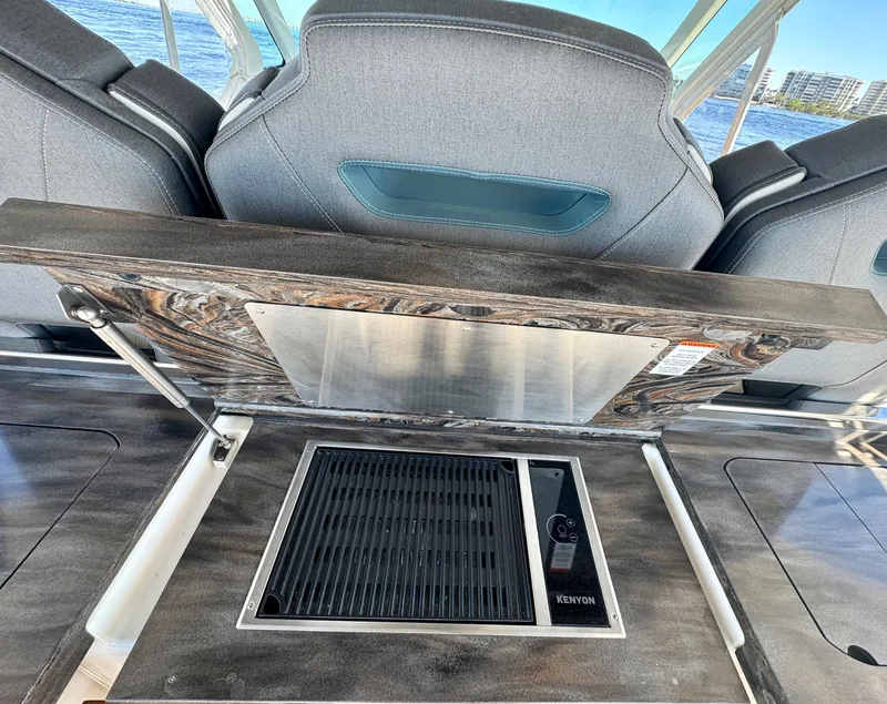 Slide: The Image of Tiara Yachts 38 LS 2018 interior with Kenyon grill and luxury seating. - 7