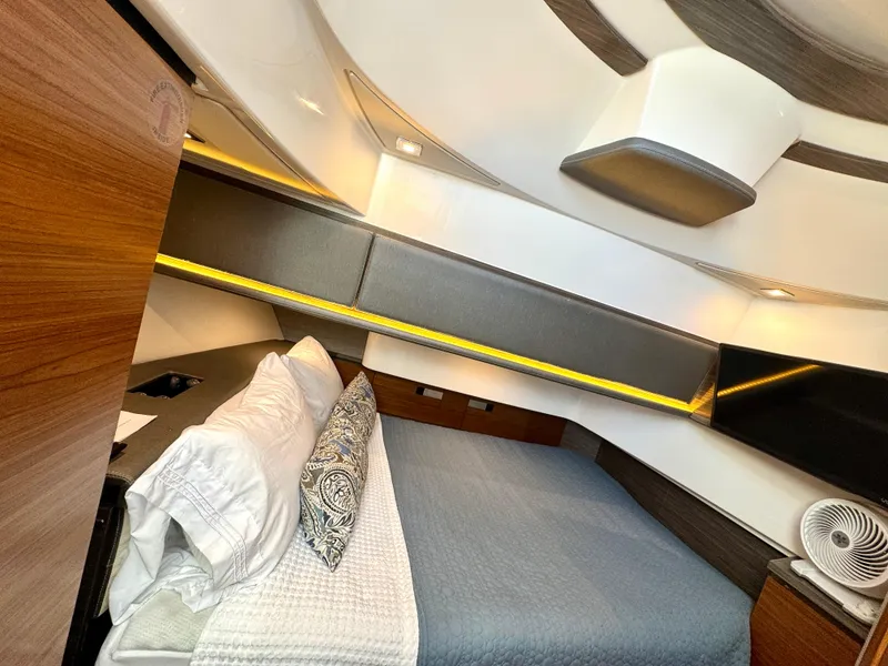 Slide: The Image of Luxurious cabin interior of 2018 Tiara Yachts 38 LS with modern bedding and lighting. - 8