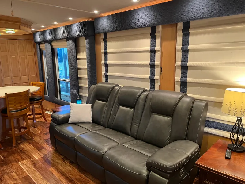 Slide: The Image of Luxurious interior of 2001 Sharpe 75 houseboat with leather sofa and elegant decor. - 11