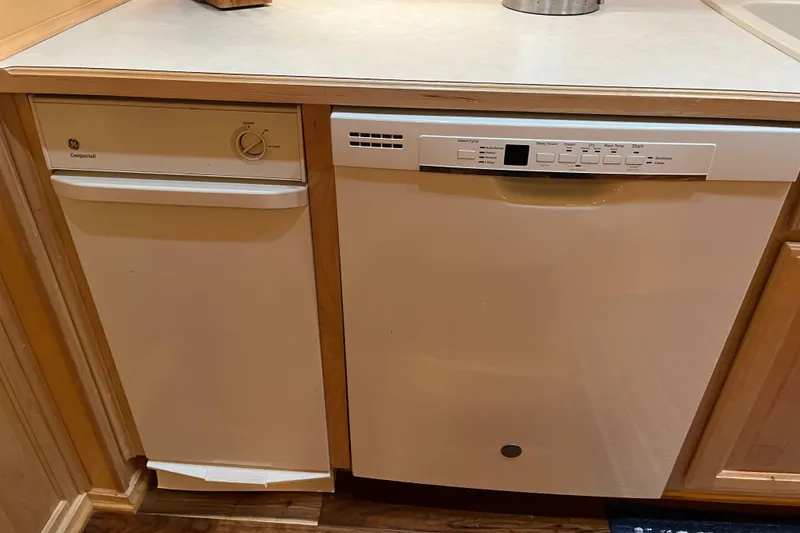 Slide: The Image of Built-in Sharpe 75 dishwasher, 2001 model, in a kitchen setting. - 15