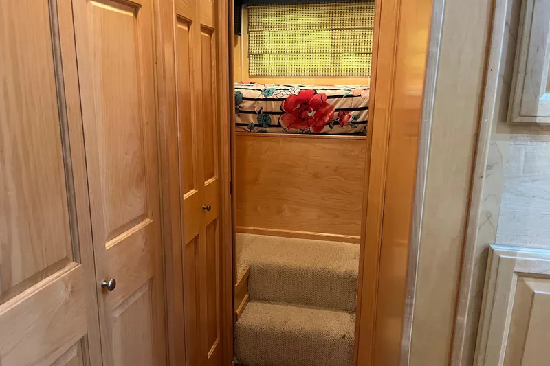 Slide: The Image of Wood-paneled hallway with carpeted stairs in 2001 Sharpe 75 model. - 18