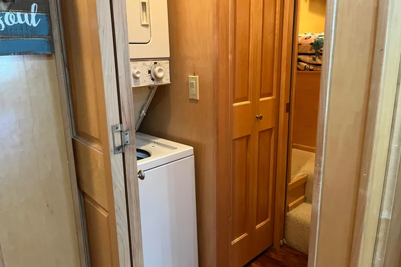 Slide: The Image of Compact laundry area in 2001 Sharpe 75 houseboat with stacked washer and dryer. - 21