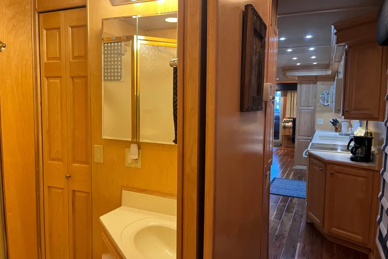 Slide: The Image of Interior of 2001 Sharpe 75 houseboat with wooden cabinetry and modern amenities. - 28