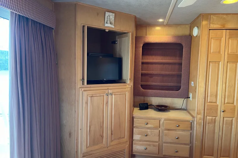 Slide: The Image of Wooden interior with TV cabinet and drawers in a 2001 Sharpe 75 model. - 37