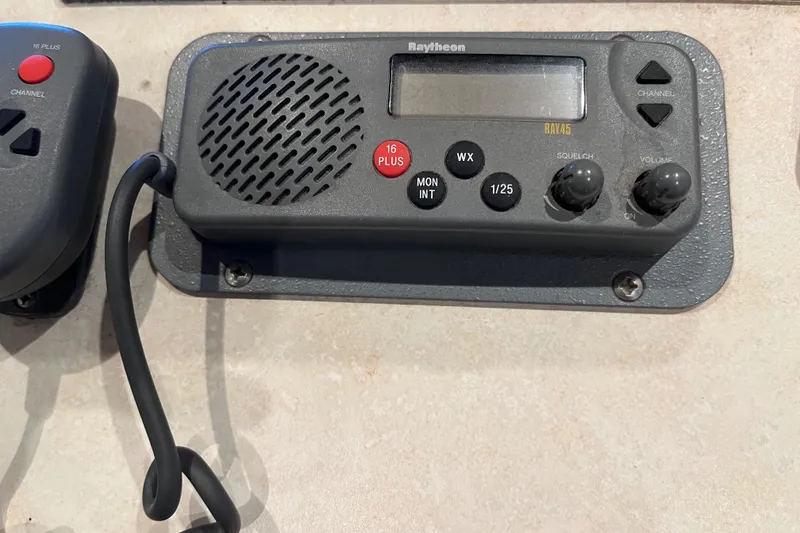 Slide: The Image of Raytheon marine radio with controls and display, model Sharpe 75, year 2001. - 46