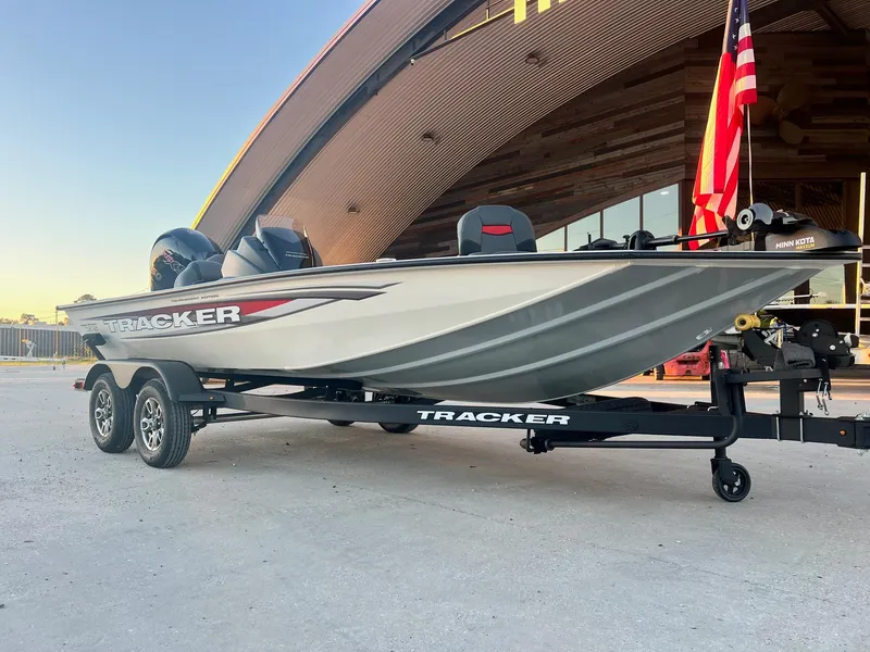 Slide: The Image of 2025 Tracker Pro Team 195 Tournament Edition boat on trailer, parked outdoors. - 10