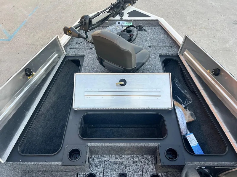 Slide: The Image of 2025 Tracker Pro Team 195 Tournament Edition boat interior with storage compartments and seating. - 4