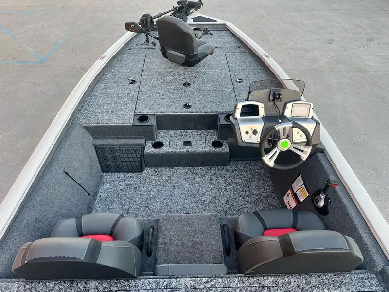 Slide: The Image of 2025 Tracker Pro Team 195 Tournament Edition boat interior with steering console and seating. - 7