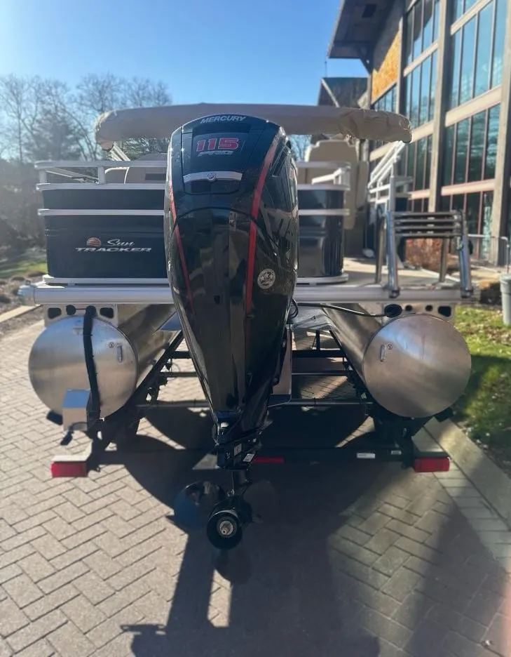 Slide: The Image of 2025 Sun Tracker Fishin' Barge 20 DLX pontoon boat with Mercury outboard motor. - 3