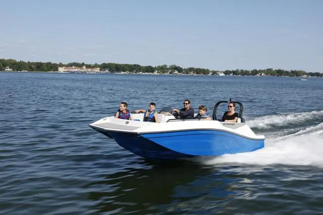 Slide: The Image of 2025 Starcraft SVX161 boat cruising on a lake with passengers. - 1