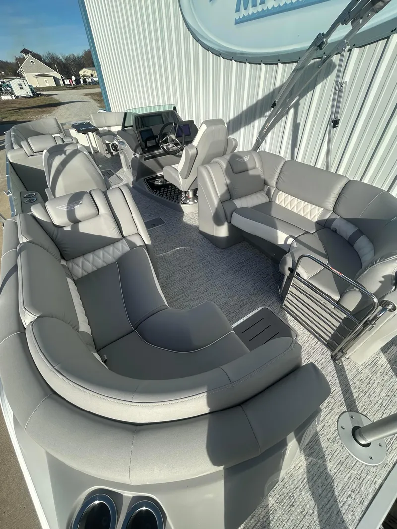 Slide: The Image of 2025 Bennington Q 27 pontoon boat with luxurious seating and modern design. - 12
