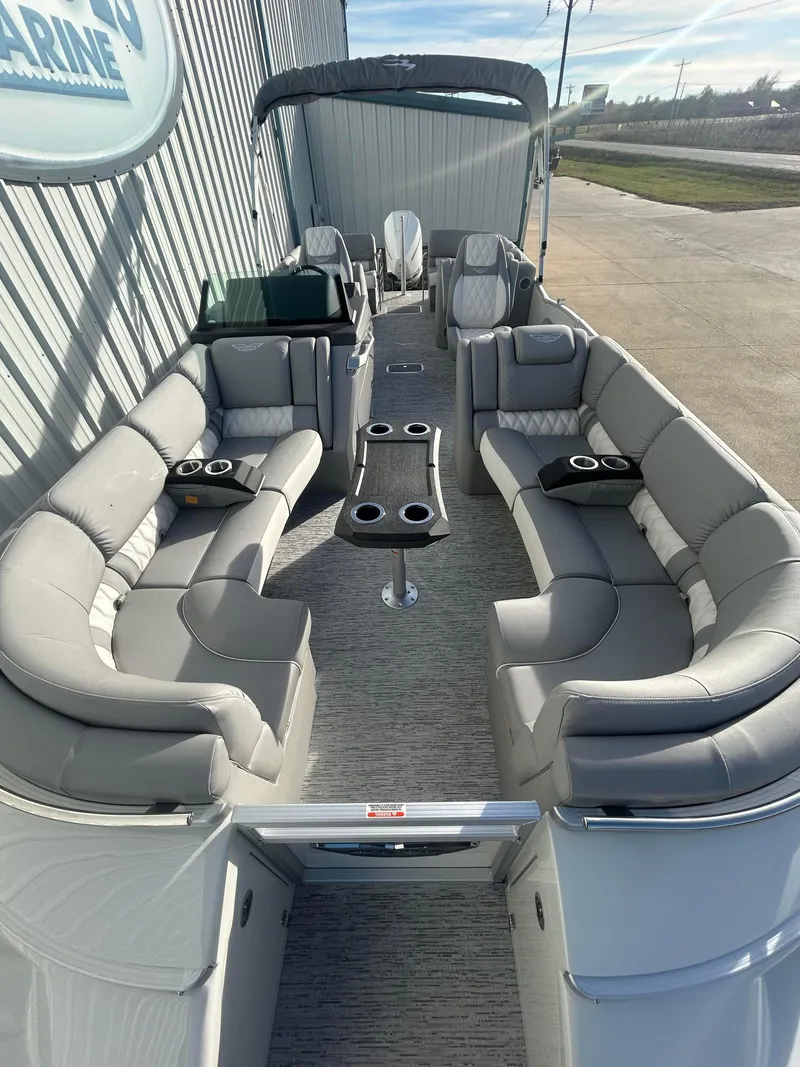 Slide: The Image of 2025 Bennington Q 27 pontoon boat with spacious seating and modern design. - 5