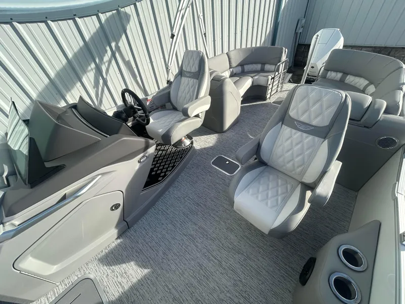 Slide: The Image of 2025 Bennington Q 27 boat interior with luxurious seating and modern design. - 6