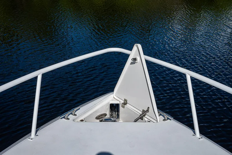 Slide: The Image of Bow of 2016 Intrepid 430 Sport Yacht on calm water. - 18