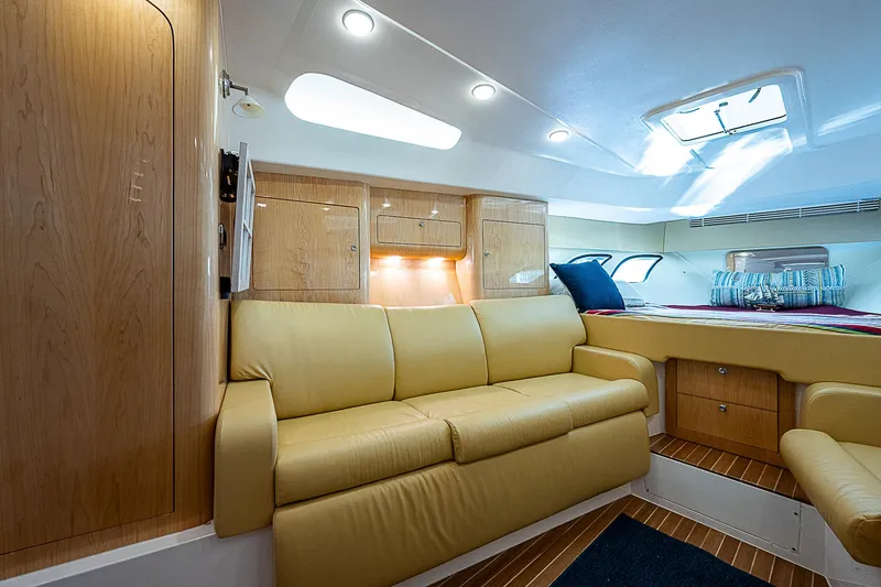 Slide: The Image of Luxurious interior of 2016 Intrepid 430 Sport Yacht with beige seating and wood accents. - 21