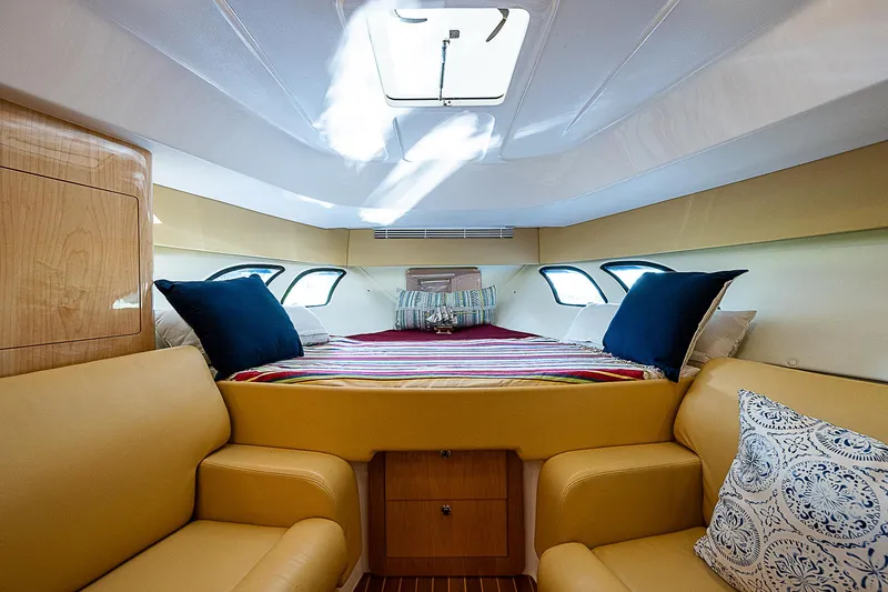 Slide: The Image of Luxurious cabin interior of 2016 Intrepid 430 Sport Yacht with cozy seating and bedding. - 22