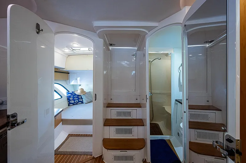 Slide: The Image of Interior of 2016 Intrepid 430 Sport Yacht, featuring cozy cabin and modern bathroom. - 33