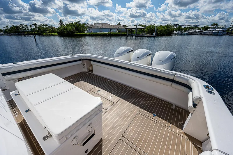 Slide: The Image of 2016 Intrepid 430 Sport Yacht deck with triple outboard motors on a sunny day. - 35