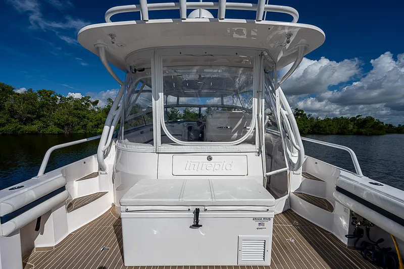 Slide: The Image of 2016 Intrepid 430 Sport Yacht, rear view, docked on a sunny day with clear skies. - 36