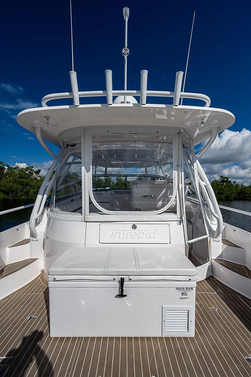 Slide: The Image of 2016 Intrepid 430 Sport Yacht, sleek design, spacious deck, clear skies, luxury boating experience. - 37