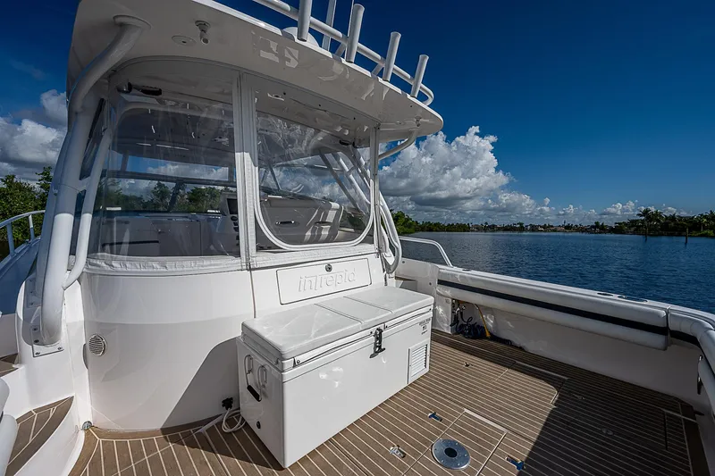 Slide: The Image of 2016 Intrepid 430 Sport Yacht deck with clear skies and water view. - 38