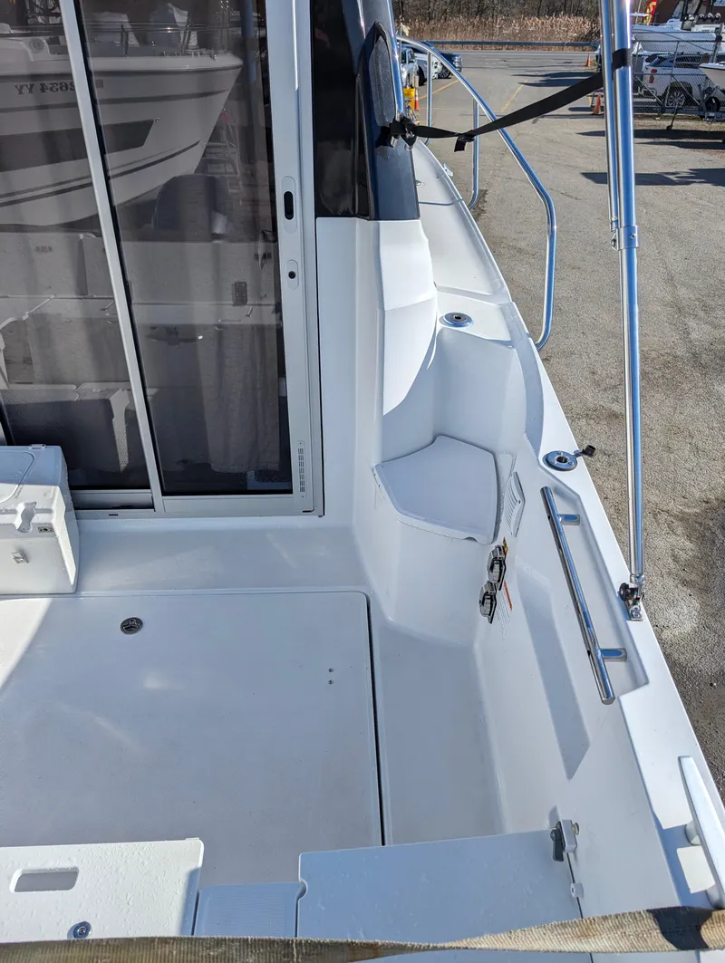 Slide: The Image of 2020 Jeanneau NC 795 boat deck with railing and sliding door. - 19