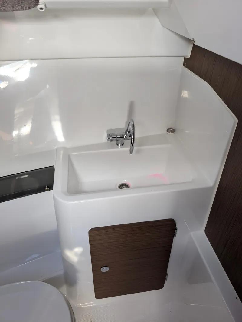 Slide: The Image of Compact bathroom sink in 2020 Jeanneau NC 795 boat interior. - 26