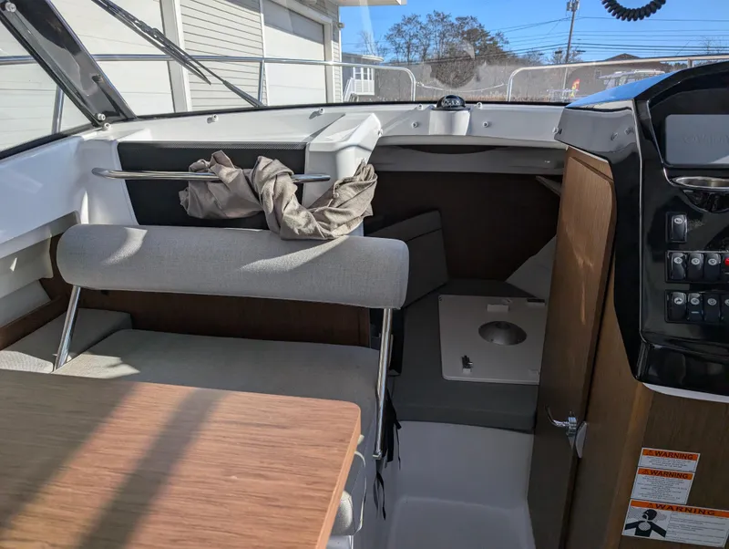 Slide: The Image of Interior of 2020 Jeanneau NC 795 boat, featuring seating and control panel. - 28