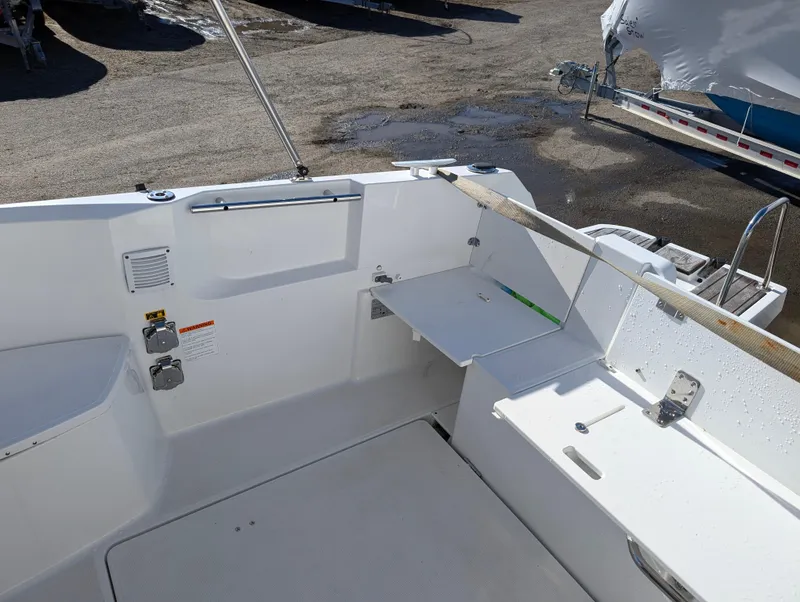 Slide: The Image of 2020 Jeanneau NC 795 boat deck with seating and storage compartments. - 37