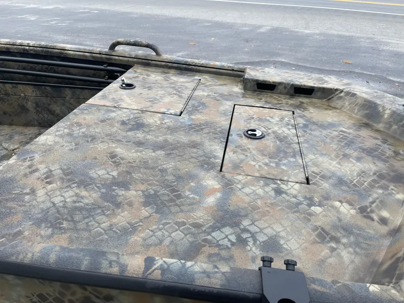 Slide: The Image of 2025 Excel Eclipse boat with camouflage pattern, featuring storage compartments on deck. - 10